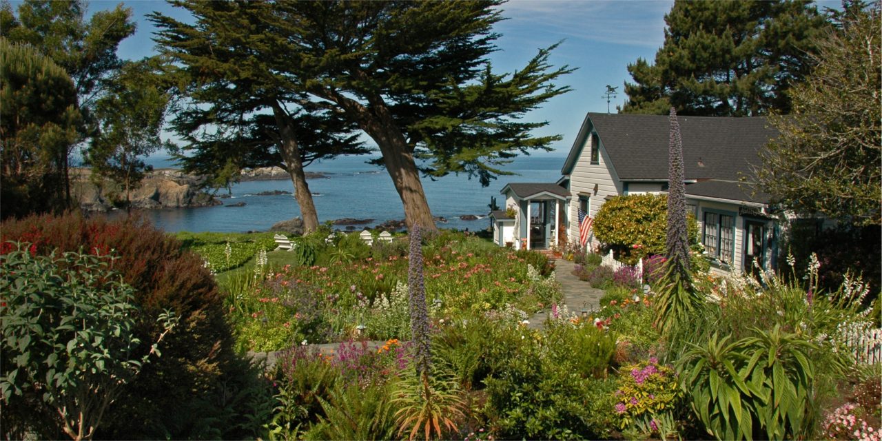 A view across the verdant gardens in front of the Agate Cove Inn, a frequent venue for Elope Mendocino weddings.